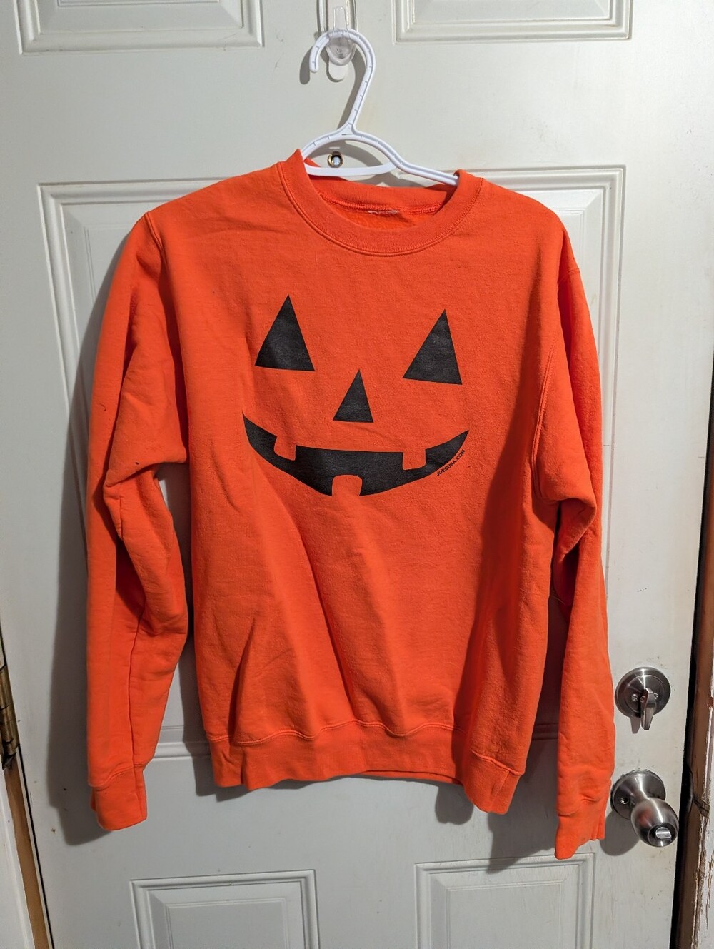 Amazon Orange Crewneck Sweatshirt with Black Jack-O'-Lantern Face